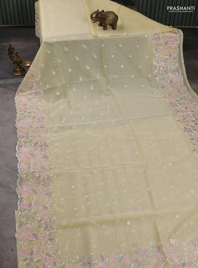 Organza saree pale yellow with embroidery sequin buttas and floral sequin embroidery border