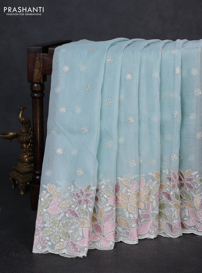 Organza saree light blue with embroidery sequin buttas and floral sequin embroidery border