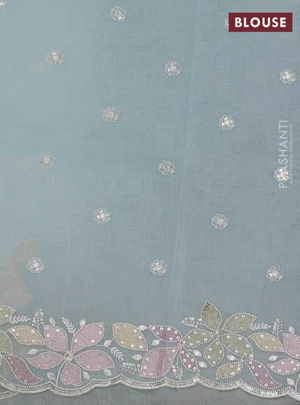 Organza saree light blue with embroidery sequin buttas and floral sequin embroidery border