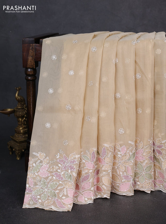 Organza saree beige with embroidery sequin buttas and floral sequin embroidery border