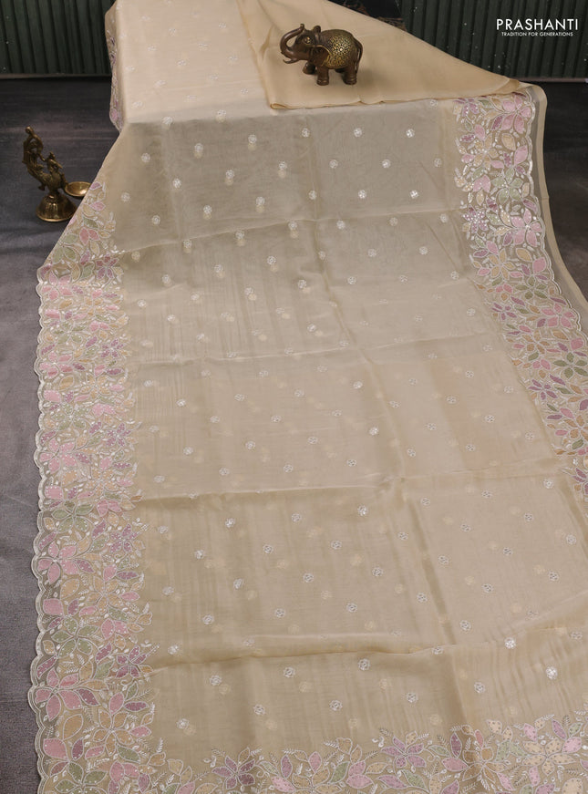 Organza saree beige with embroidery sequin buttas and floral sequin embroidery border