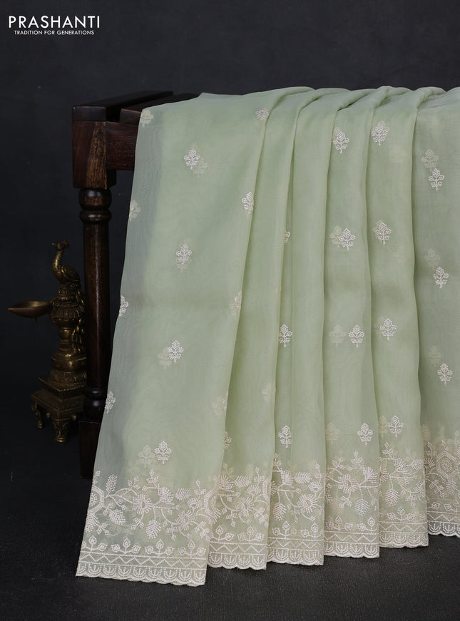 Organza saree pista green with embroidery buttas and embroidery border