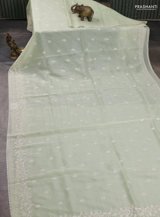 Organza saree pista green with embroidery buttas and embroidery border