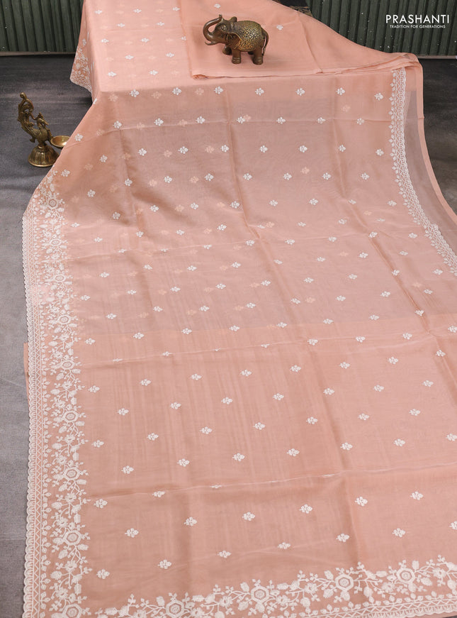 Organza saree peach shade with embroidery buttas and embroidery border