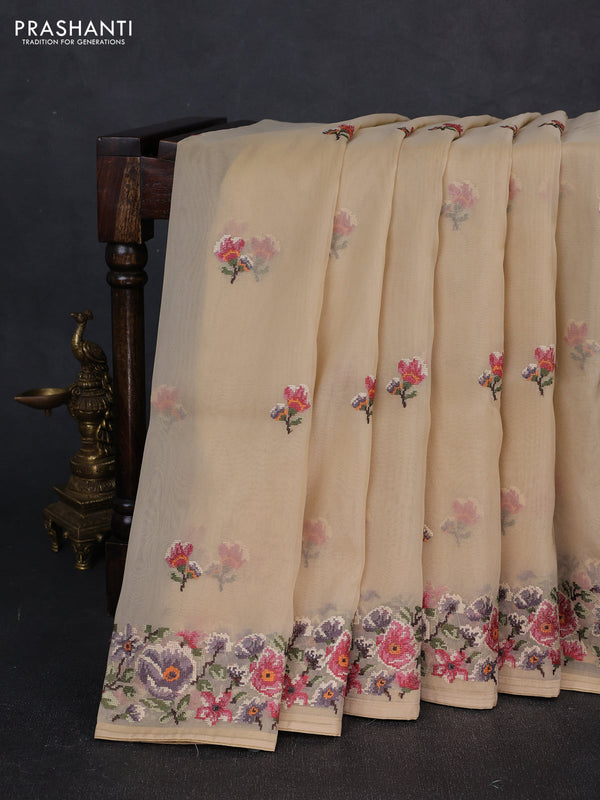 Organza saree beige with embroidery buttas and convent embroidery border