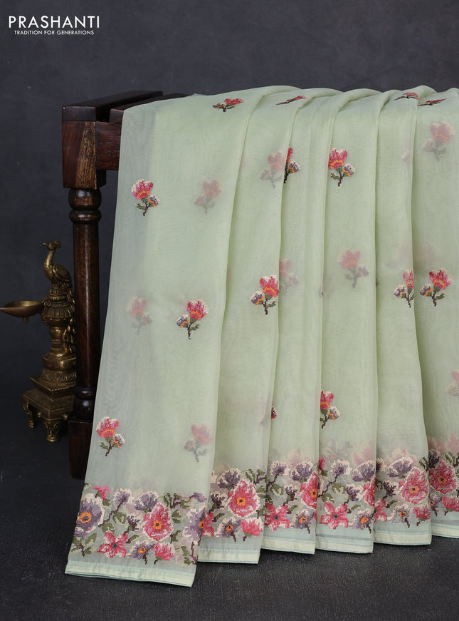 Organza saree pista green with embroidery buttas and convent embroidery border