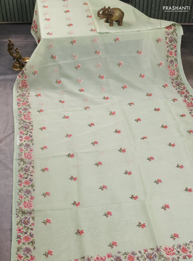 Organza saree pista green with embroidery buttas and convent embroidery border