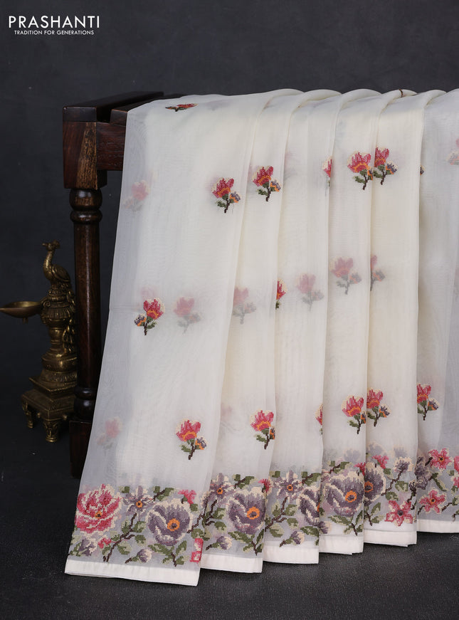 Organza saree cream with embroidery buttas and convent embroidery border