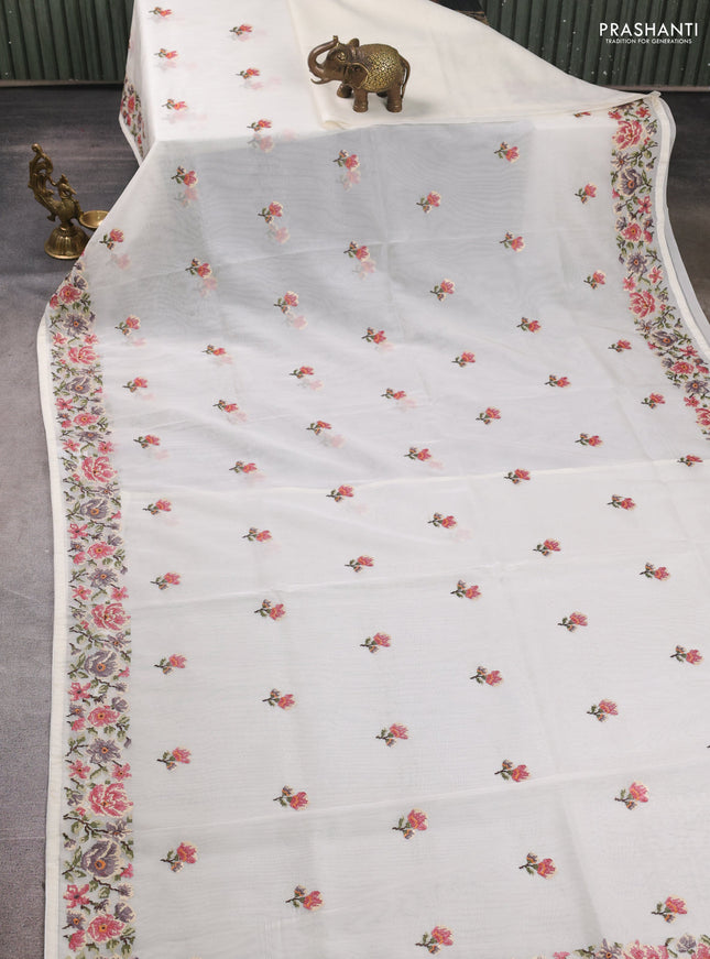 Organza saree cream with embroidery buttas and convent embroidery border
