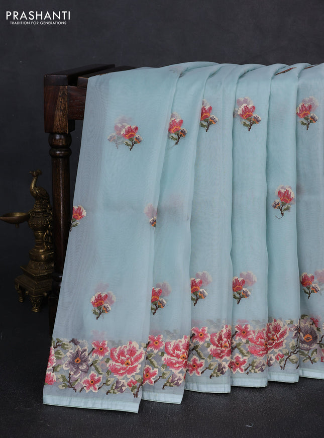 Organza saree light blue with embroidery buttas and convent embroidery border