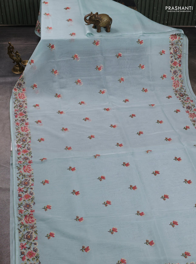 Organza saree light blue with embroidery buttas and convent embroidery border