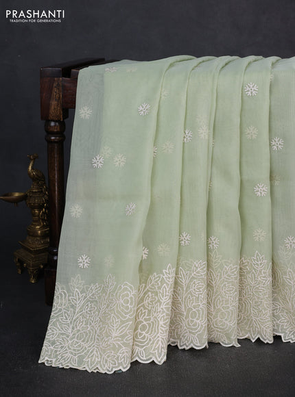 Organza saree pista green with embroidery buttas and floral embroidery border