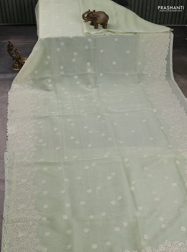 Organza saree pista green with embroidery buttas and floral embroidery border