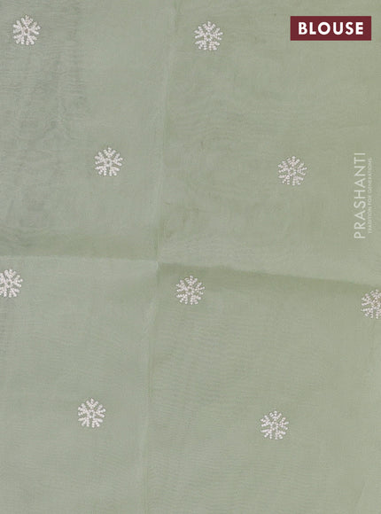 Organza saree pista green with embroidery buttas and floral embroidery border