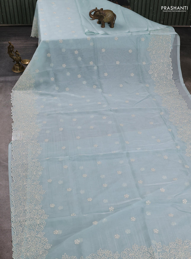 Organza saree light blue with embroidery buttas and floral embroidery border
