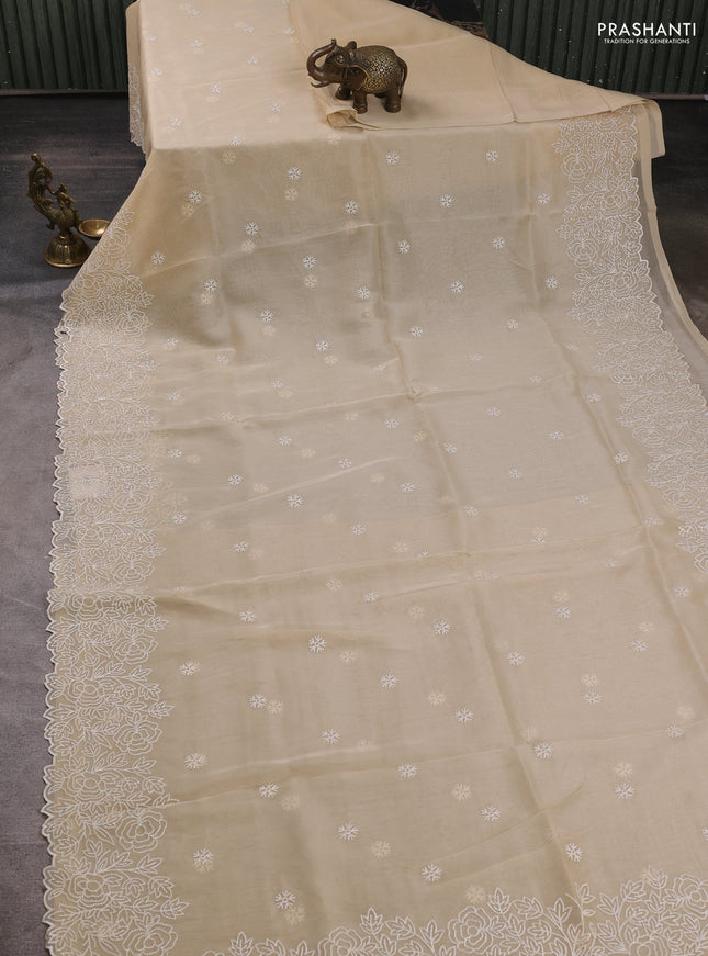 Organza saree beige with embroidery buttas and floral embroidery border
