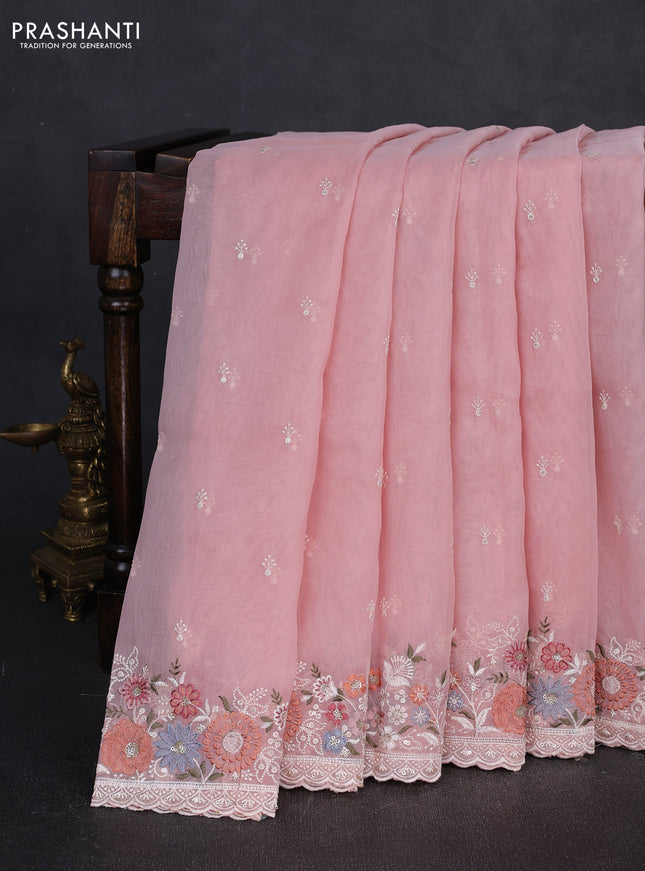 Organza saree peach shade with embroidery buttas and embroidery border