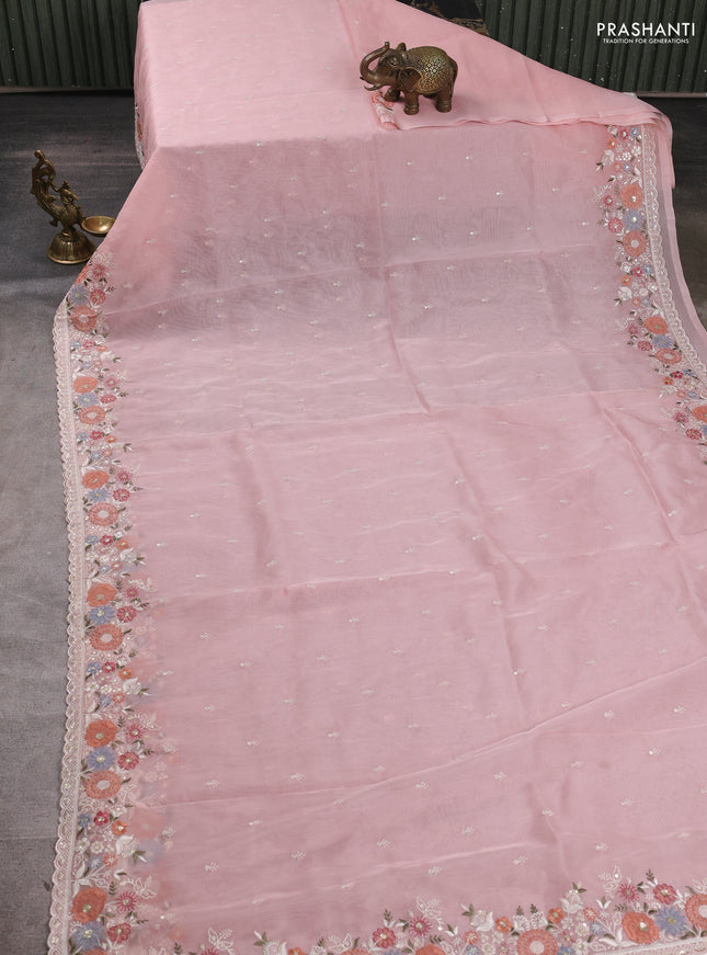 Organza saree peach shade with embroidery buttas and embroidery border