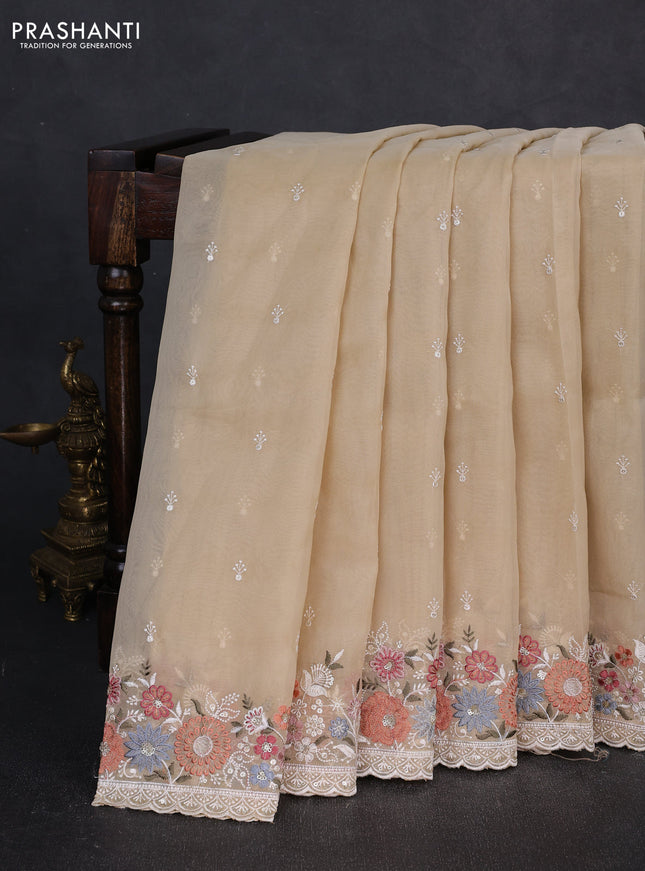 Organza saree beige with embroidery buttas and embroidery border