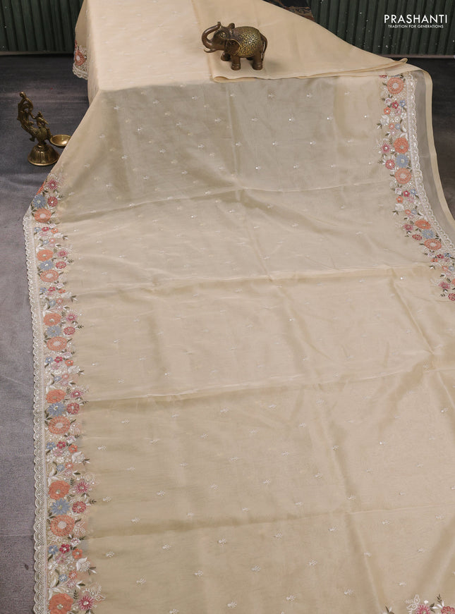 Organza saree beige with embroidery buttas and embroidery border