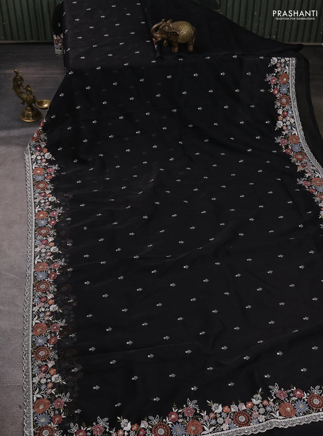 Organza saree black with embroidery buttas and embroidery border