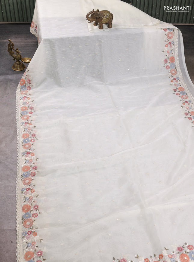 Organza saree cream with embroidery buttas and embroidery border