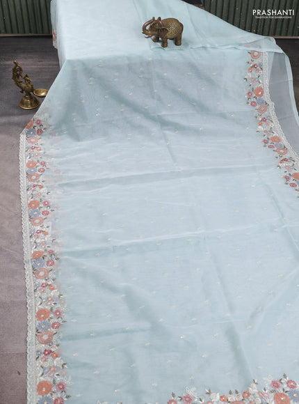 Organza saree light blue with embroidery buttas and embroidery border