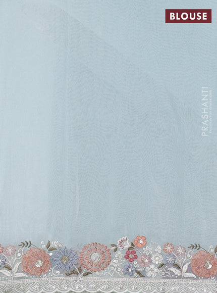 Organza saree light blue with embroidery buttas and embroidery border