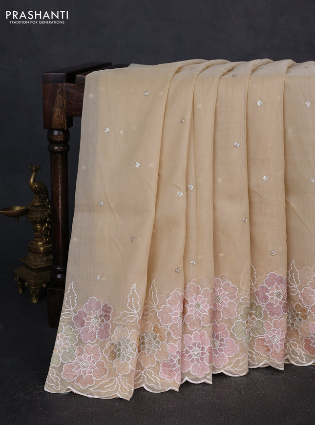Organza saree beige with sequin embroidery buttas and floral embroidery border
