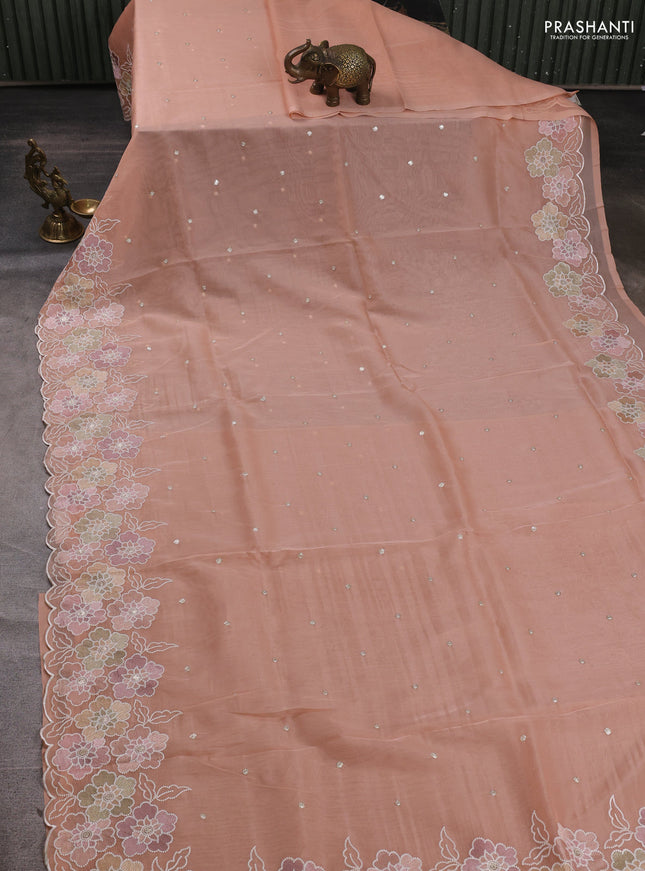 Organza saree peach shade with sequin embroidery buttas and floral embroidery border