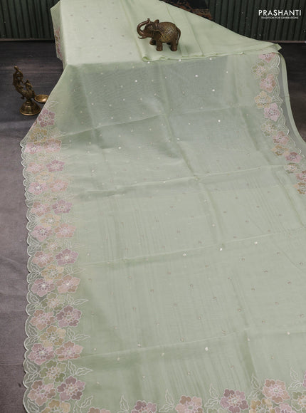 Organza saree pista green with sequin embroidery buttas and floral embroidery border