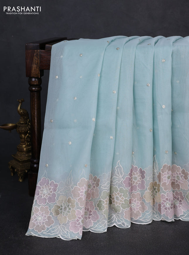 Organza saree teal blue with sequin embroidery buttas and floral embroidery border