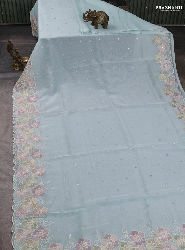 Organza saree teal blue with sequin embroidery buttas and floral embroidery border