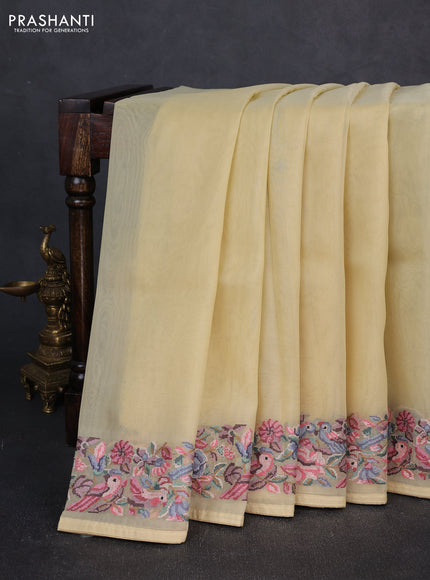 Organza saree pale yellow with plain body and convent embroidery border