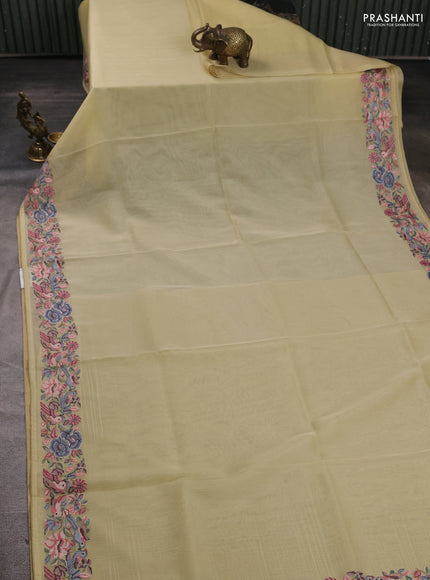 Organza saree pale yellow with plain body and convent embroidery border