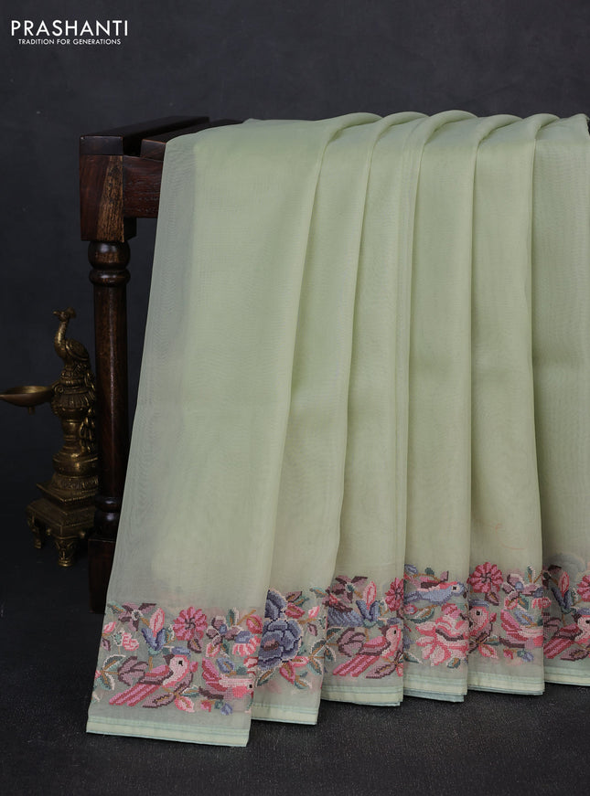 Organza saree pista green with plain body and convent embroidery border
