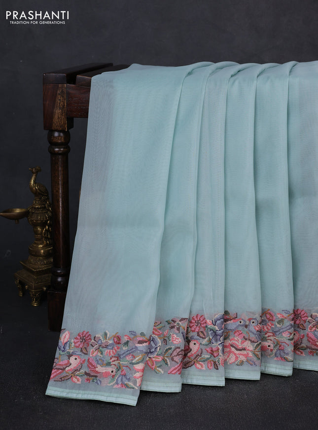 Organza saree teal blue with plain body and convent embroidery border