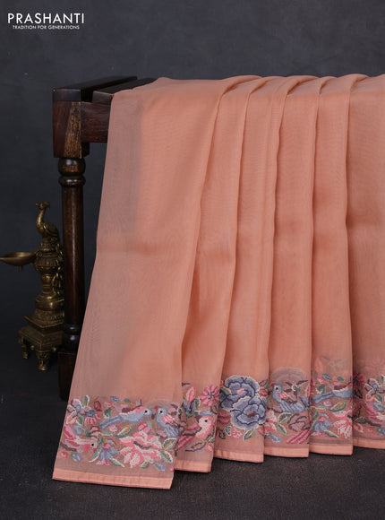 Organza saree peach shade with plain body and convent embroidery border