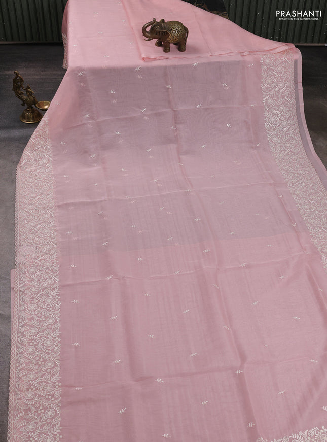Organza saree peach shade with embroidery buttas and embroidery border