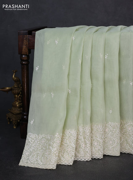 Organza saree pista green with embroidery buttas and embroidery border