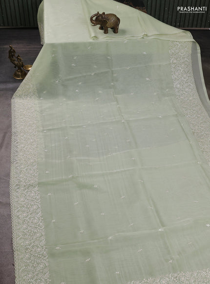 Organza saree pista green with embroidery buttas and embroidery border