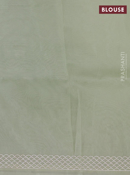 Organza saree pista green with embroidery buttas and embroidery border