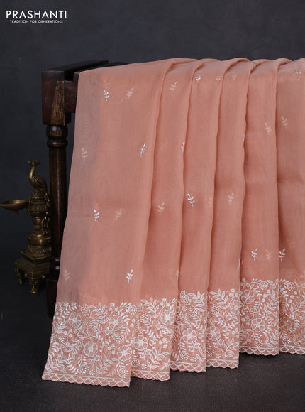 Organza saree pastel peach with embroidery buttas and embroidery border