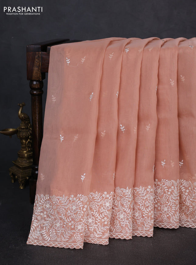 Organza saree pastel peach with embroidery buttas and embroidery border