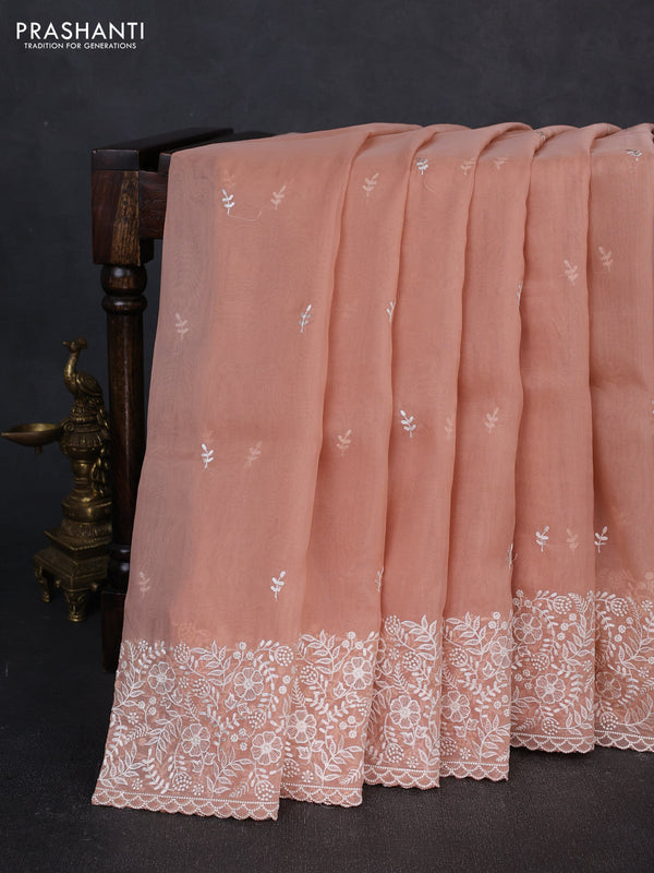 Organza saree pastel peach with embroidery buttas and embroidery border