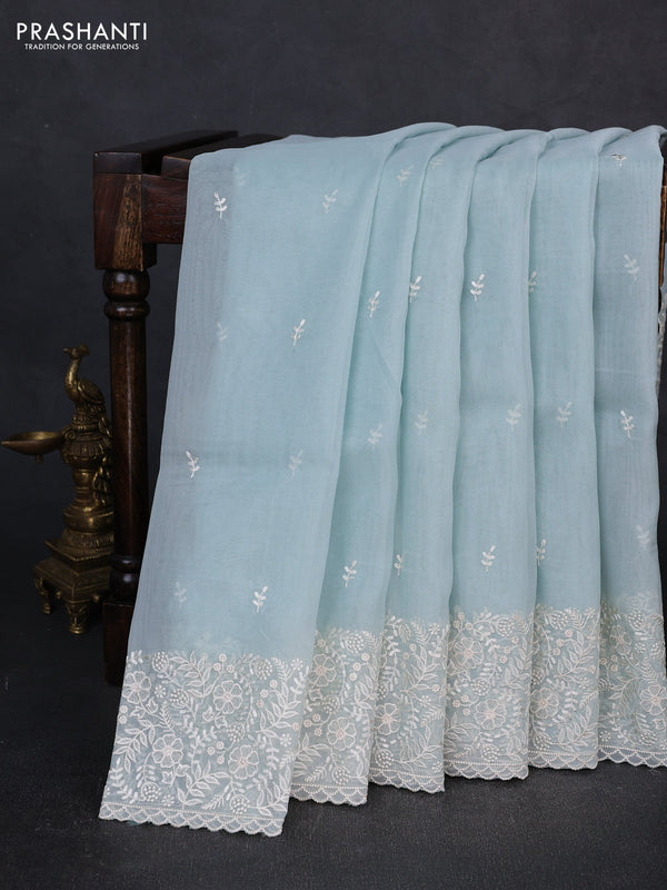 Organza saree teal blue with embroidery buttas and embroidery border