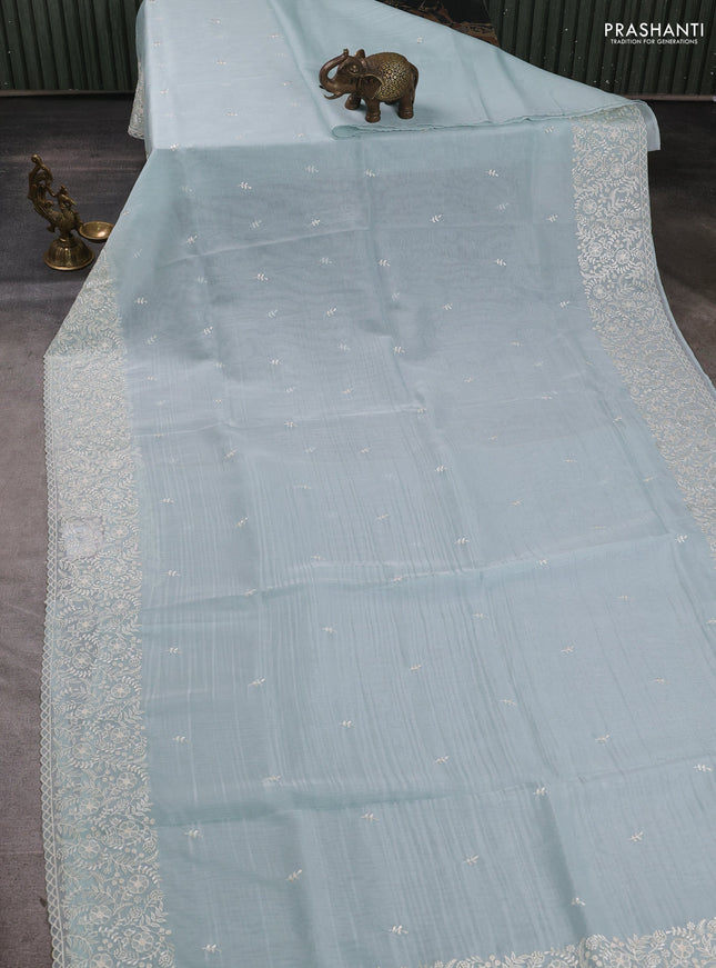 Organza saree teal blue with embroidery buttas and embroidery border