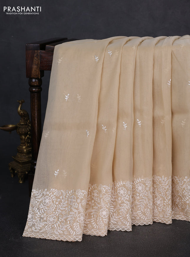 Organza saree beige with embroidery buttas and embroidery border