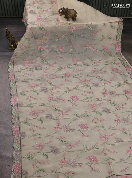 Tissue organza saree cream with allover floral embroidery and embroidery border