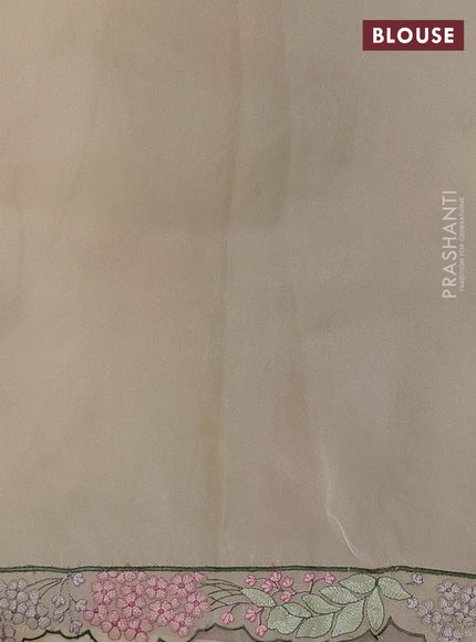 Tissue organza saree cream with allover floral embroidery and embroidery border